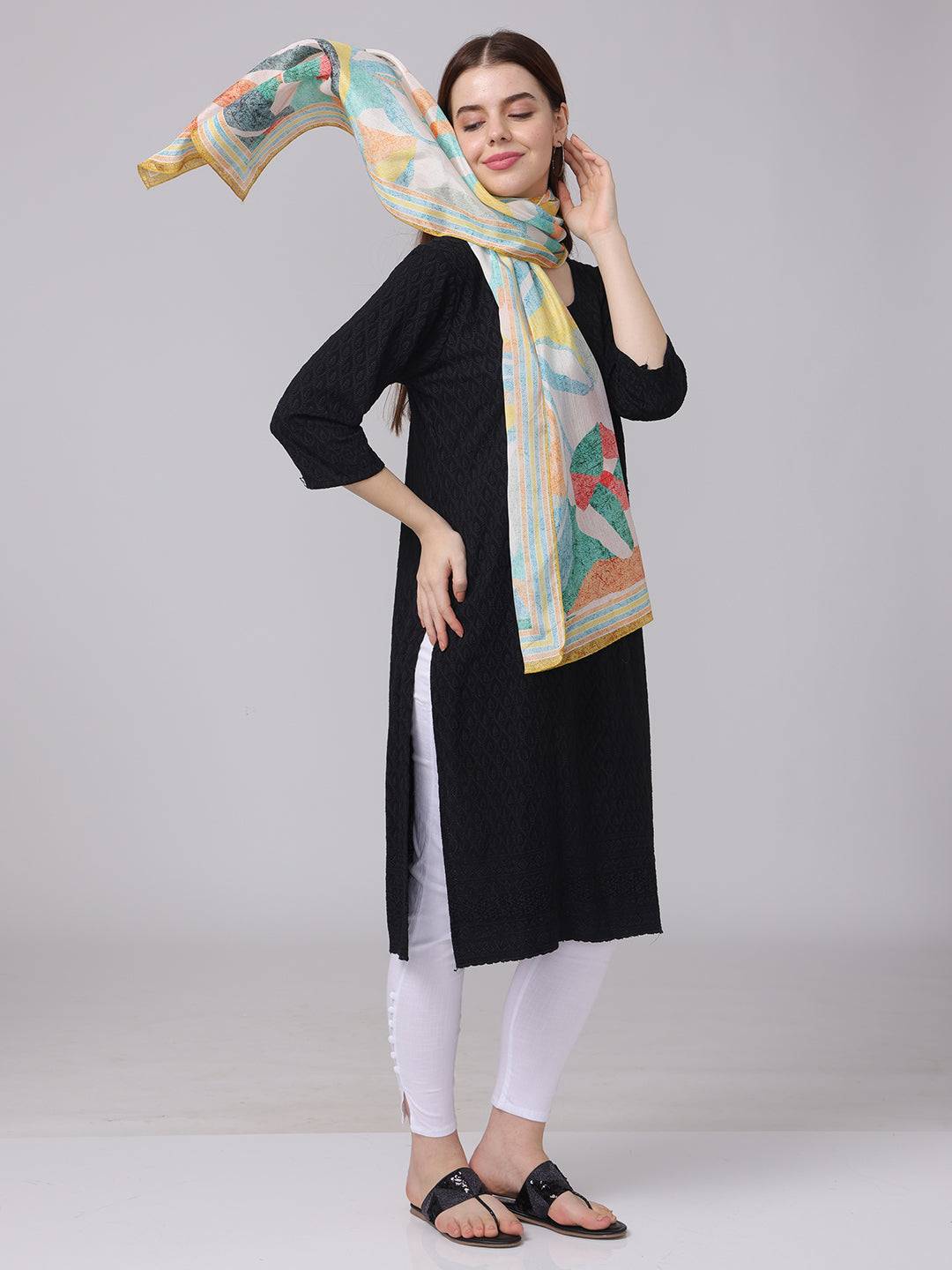 Model wearing abstract design scarf with vibrant colors.