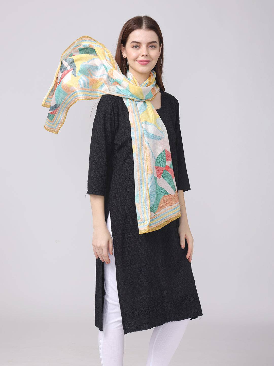 Abstract design scarf styled elegantly around neck.