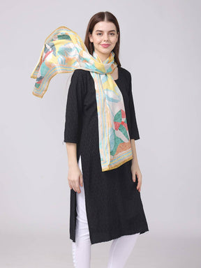 Abstract design scarf styled elegantly around neck.