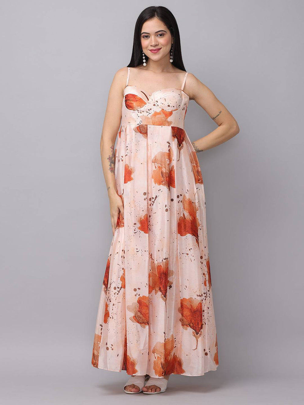 Peach color corset dress with floral pattern, front view.