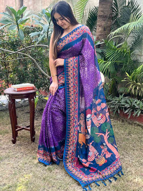 Elegant purple saree with Bandhej and Kalamkari design, garden view