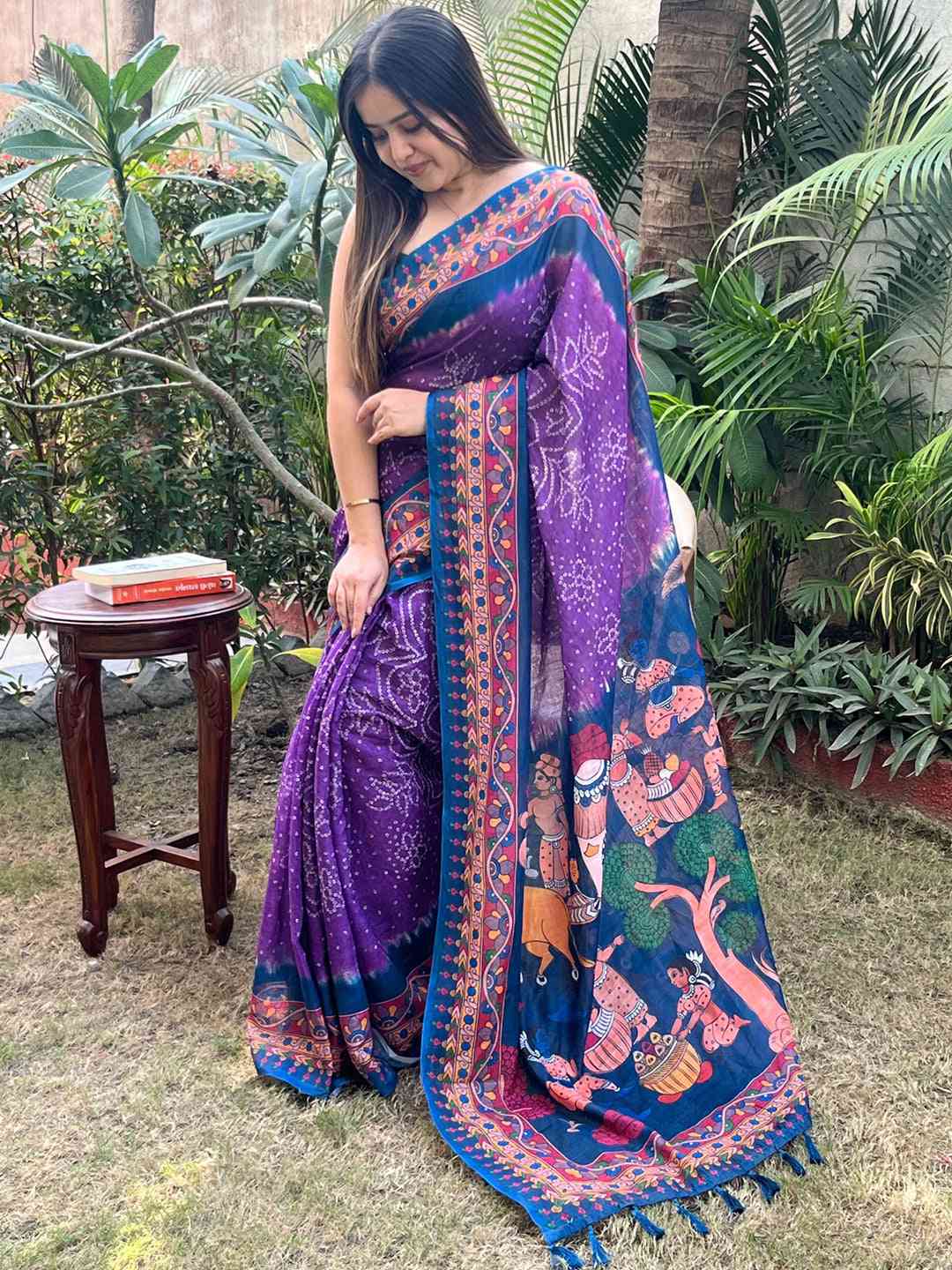 Elegant purple saree with Bandhej and Kalamkari design, garden view
