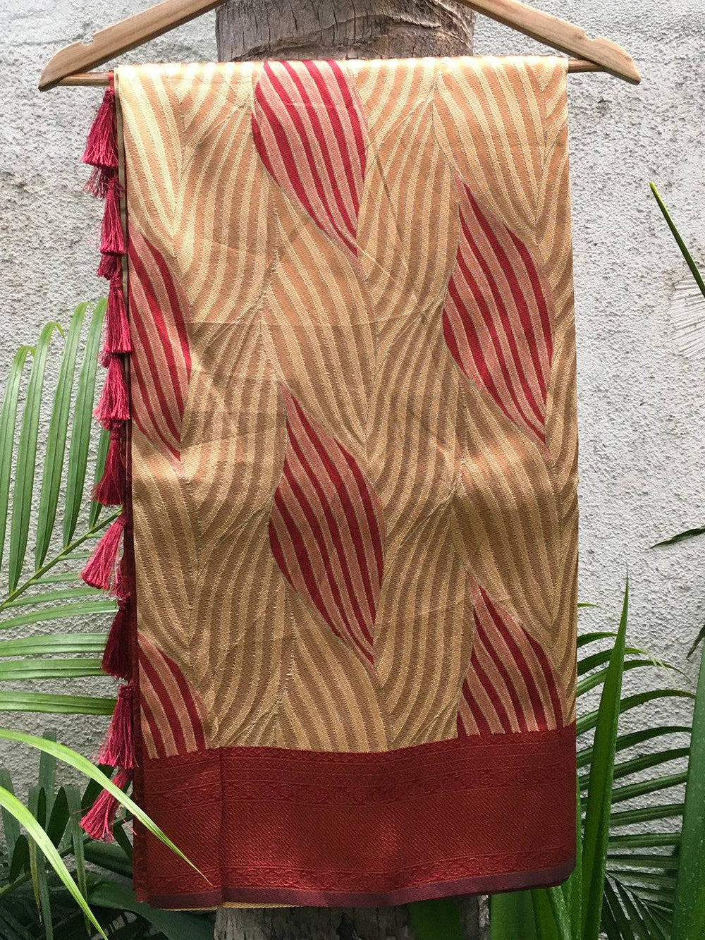 Tan Brown Ikkat Saree Draped on Hanger