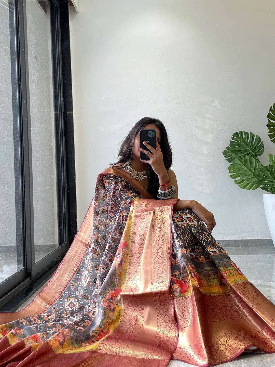 Sitting pose with Moonga Silk Kota Doriya Patola saree