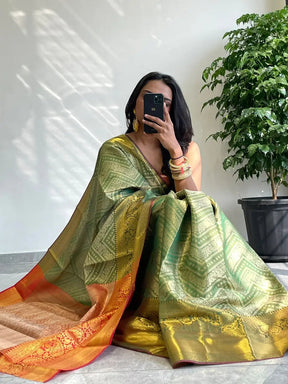 Exquisite gold zari Kanjivaaram saree with vibrant design.