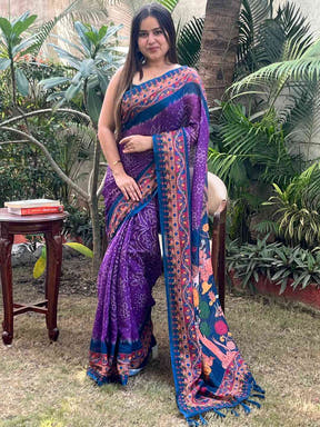 Model wearing purple Bandhej Kalamkari saree, outdoor scene