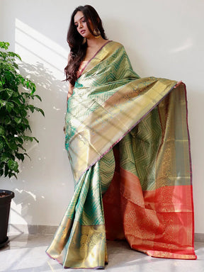 Elegant gold zari Kanjivaaram silk saree draped on model.