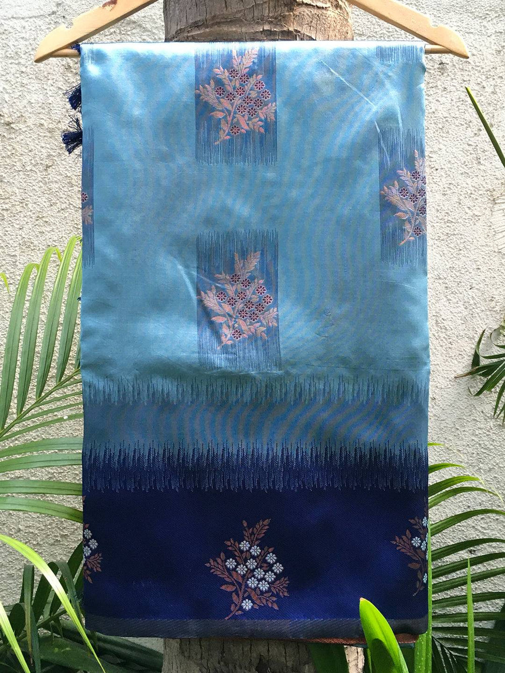 Sky blue Sami Banarasi Tussar silk saree draped on hanger