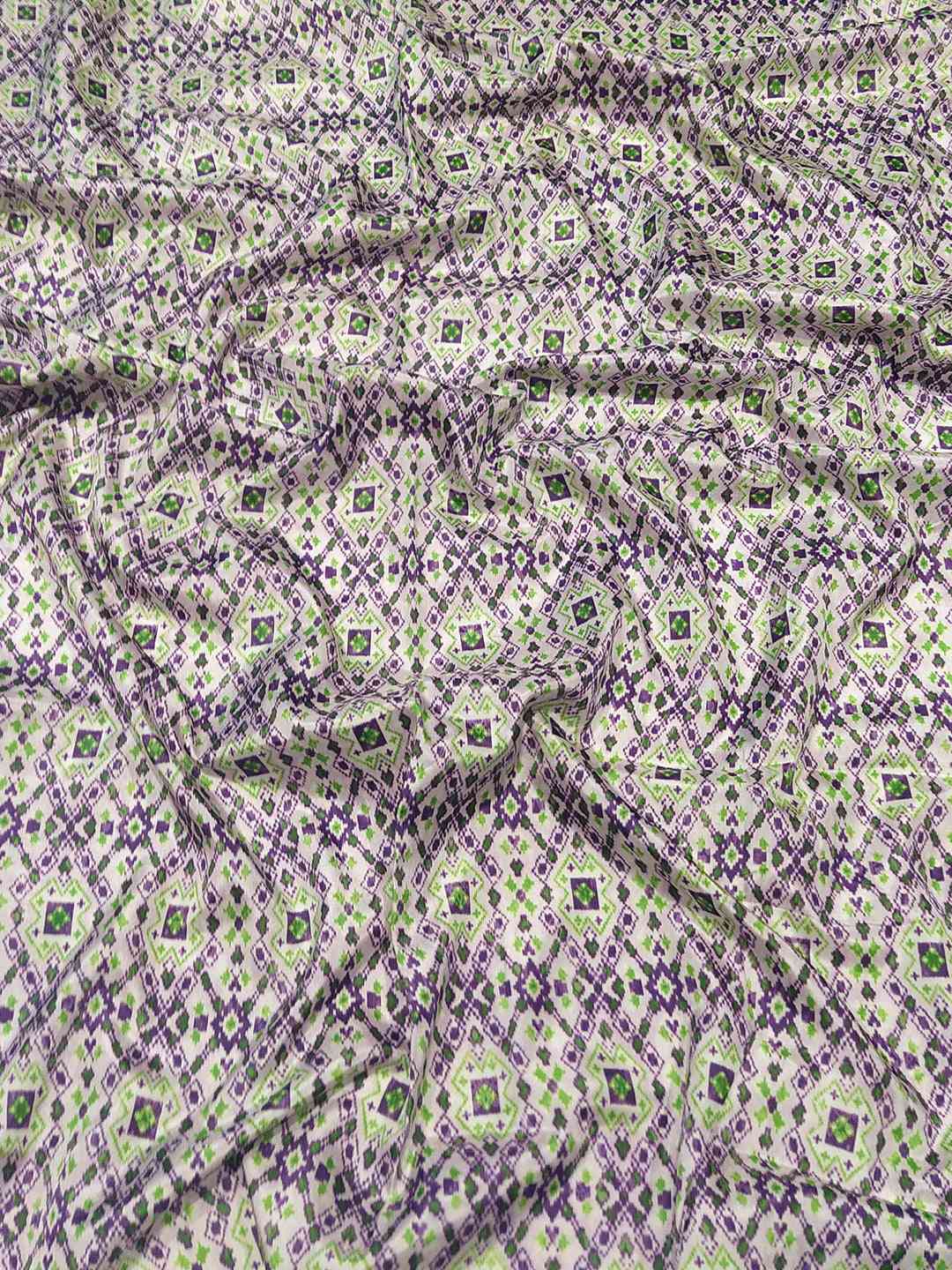 Close-up of pink Patola print fabric of Kanjivaram saree