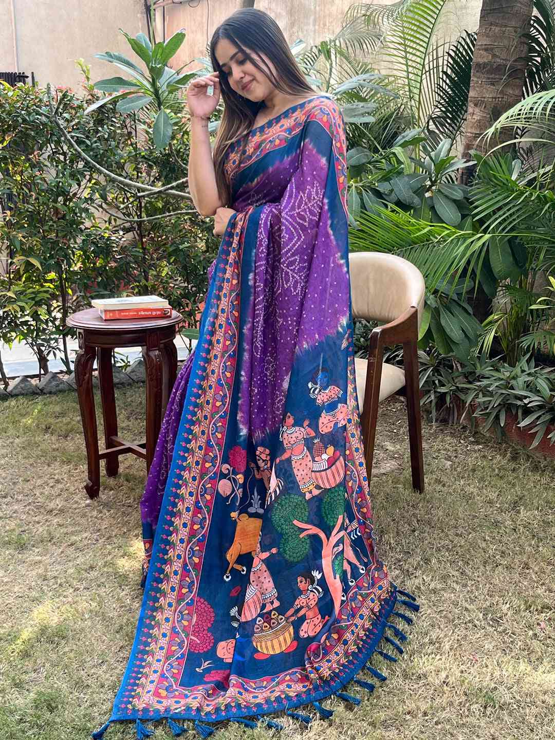 Model in purple Bandhej Kalamkari saree, lush garden backdrop