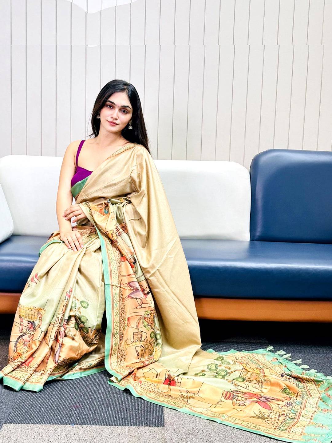 Green Free Hand Kalamkari Print Saree draped elegantly on a woman.