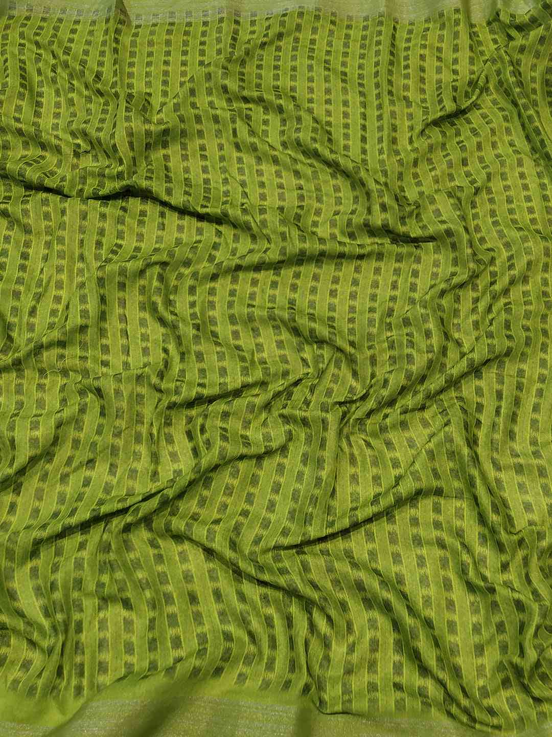 Green patterned fabric of floral Ikkat saree