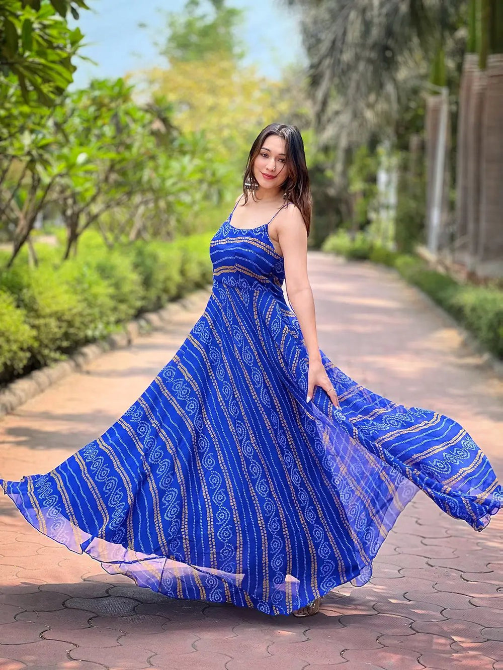 Flowy Royal Blue Bandhej Dress in garden setting