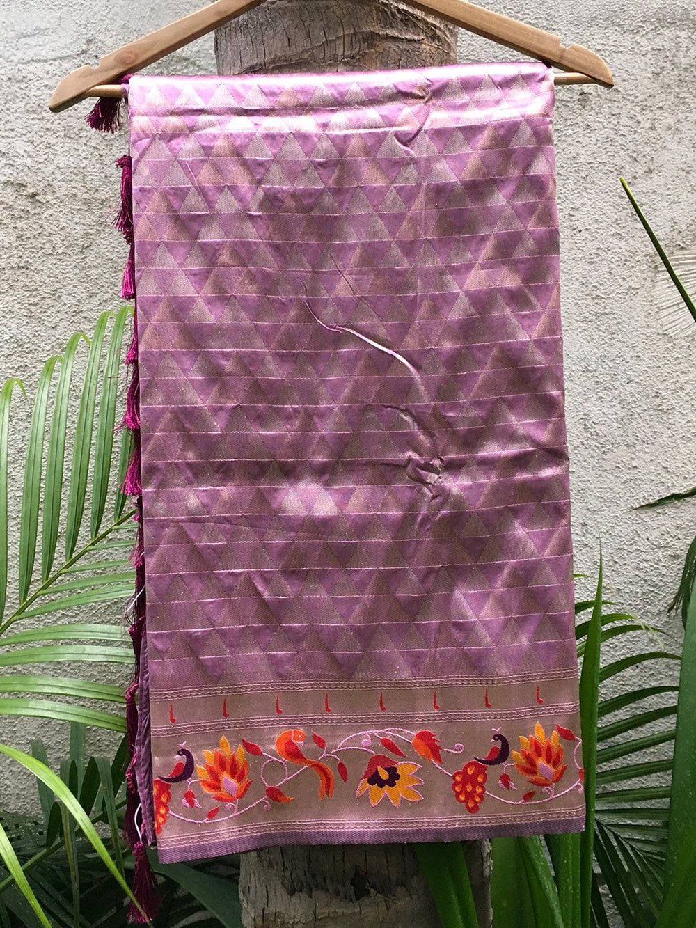 Folded light wine silk blend saree with floral zari border