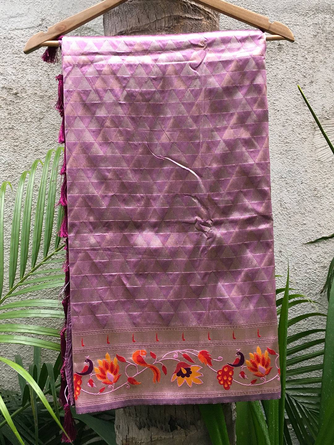 Folded light wine silk blend saree with floral zari border