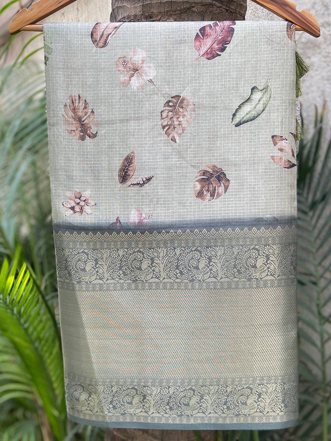 Green Kota Doriya saree with floral print and gold zari border