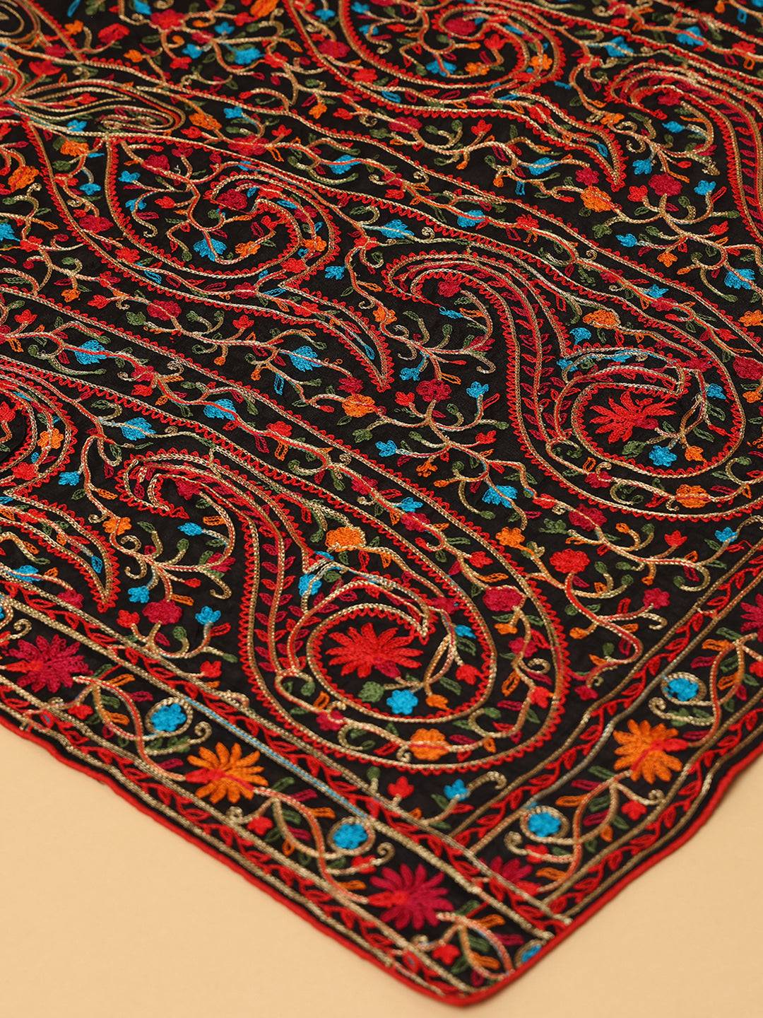 Close-up of black dupatta showcasing colorful pashmina embroidery