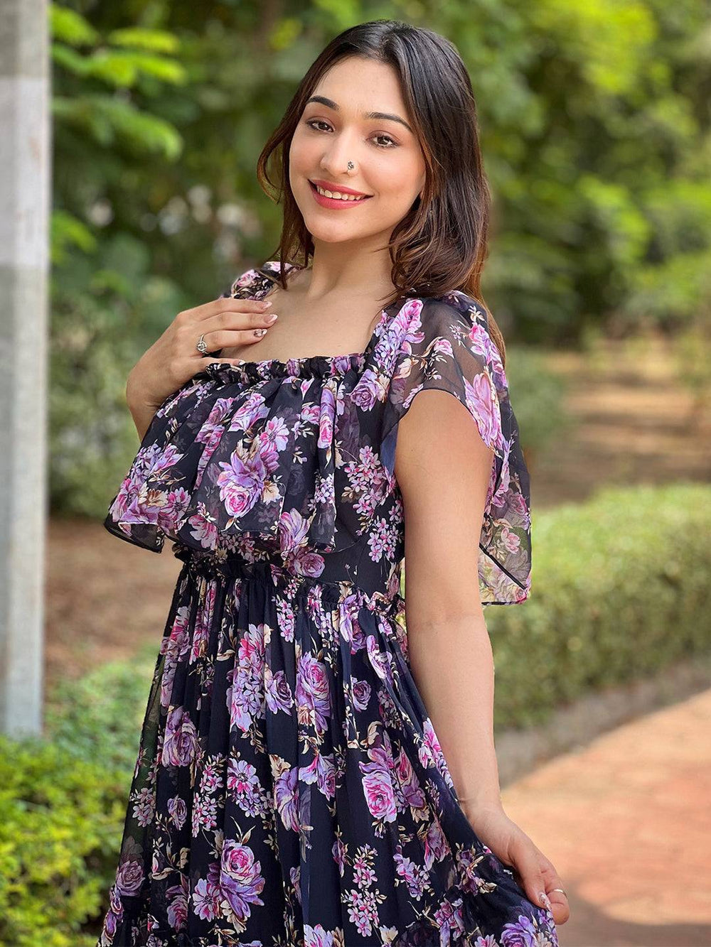 Model in floral off-shoulder dress with ruffle sleeves