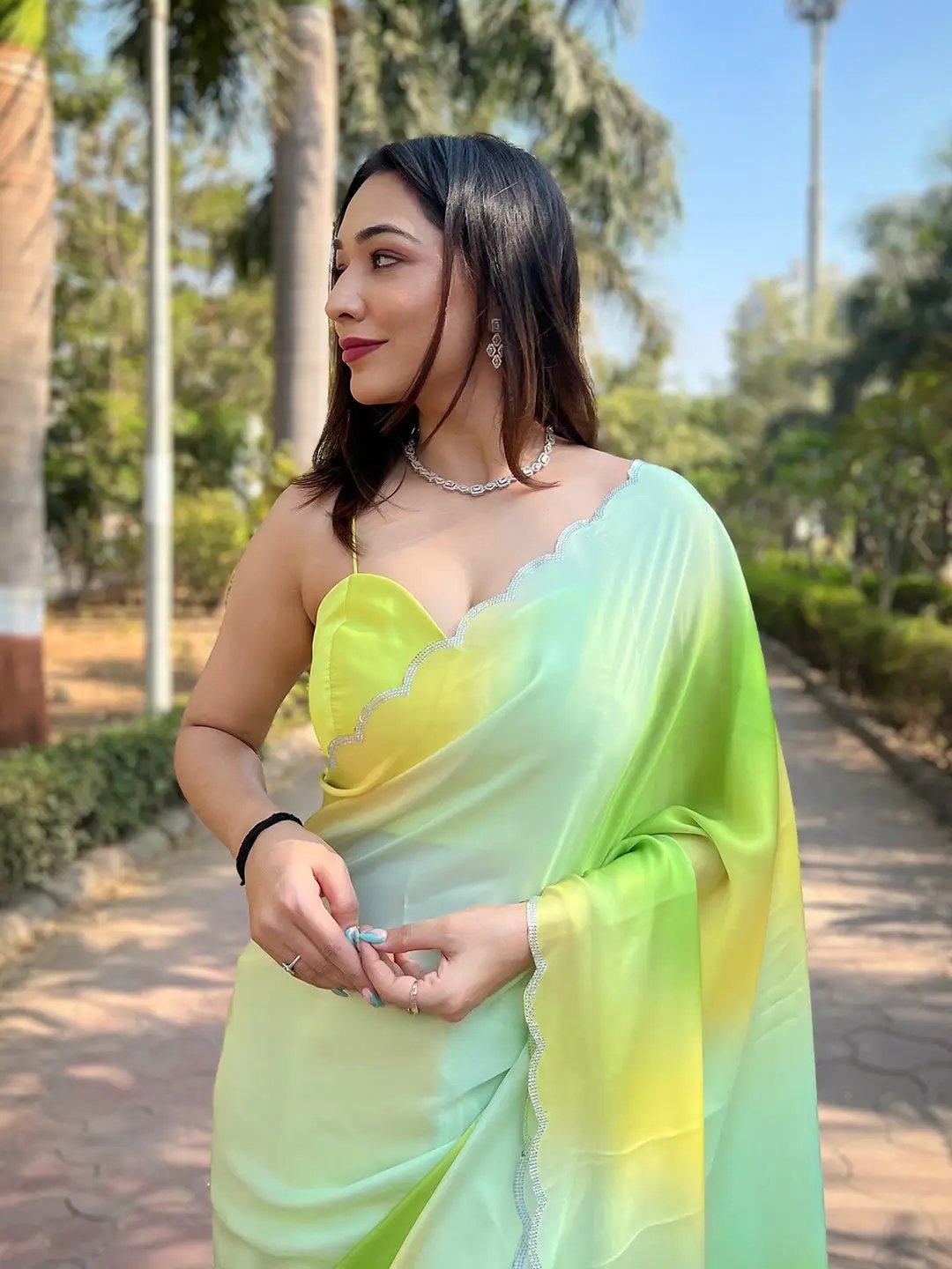 Elegant pista satin georgette saree with stone accents