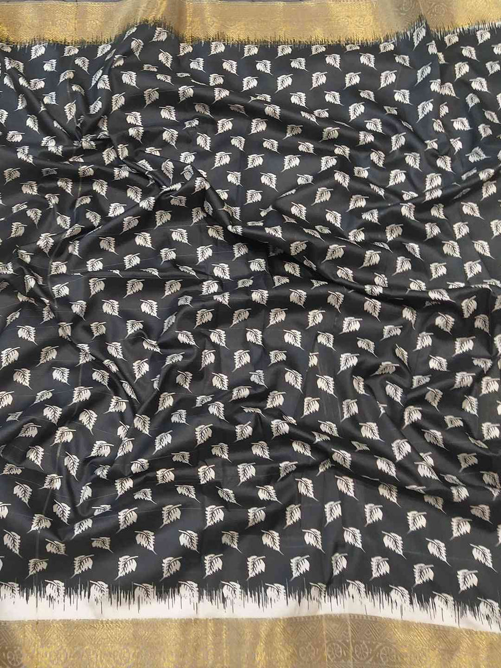 Black and gold Kalamkari saree with leaf pattern design