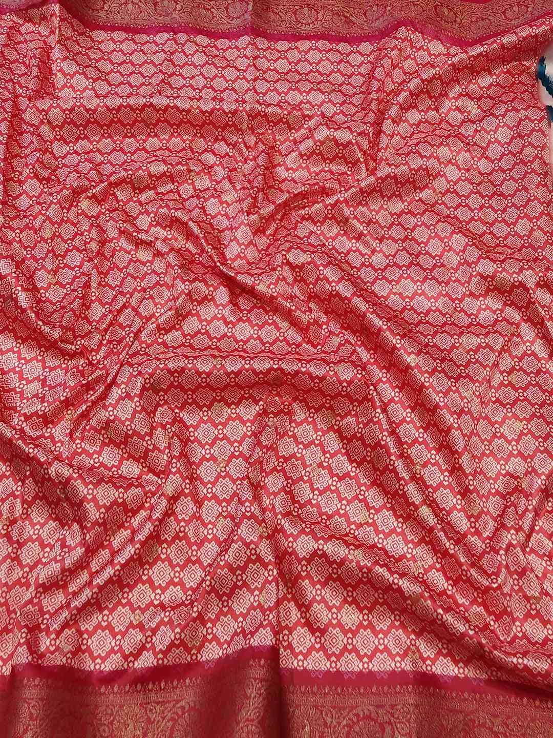 Close-up of pink Zari Patola pallu on Banarasi silk saree