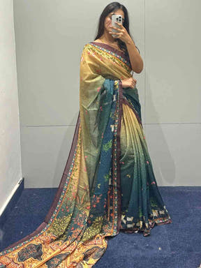 Turquoise Pichwai Print Saree displayed in fitting room.