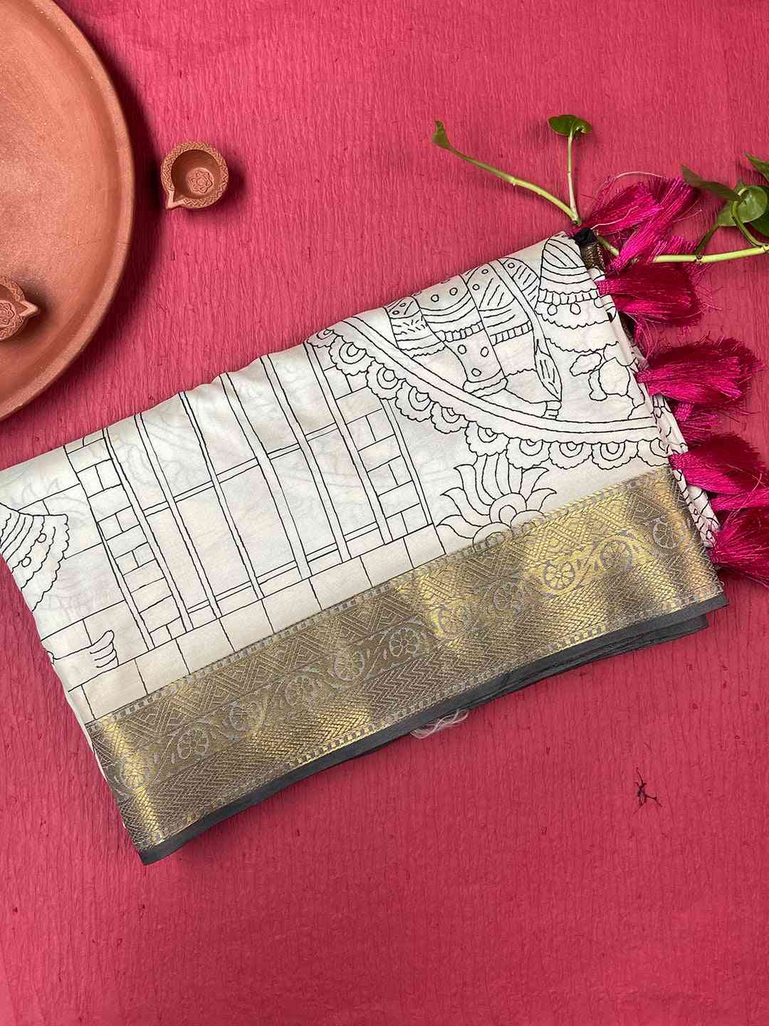 Folded Kalamkari saree with gold border and tassels
