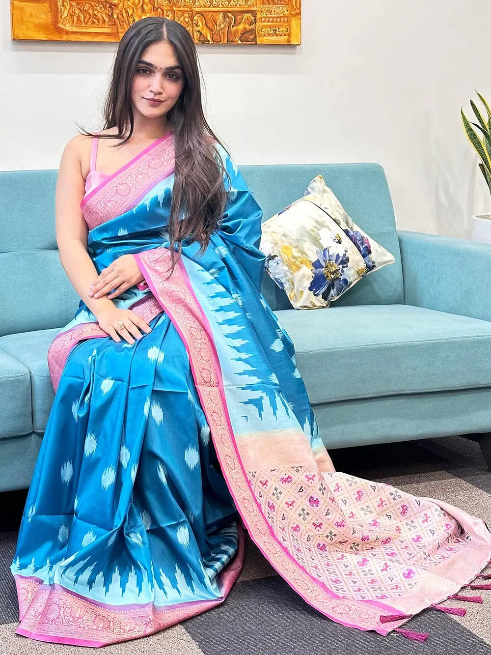 Model wearing soft silk blue Banarasi saree with zari patola pallu.
