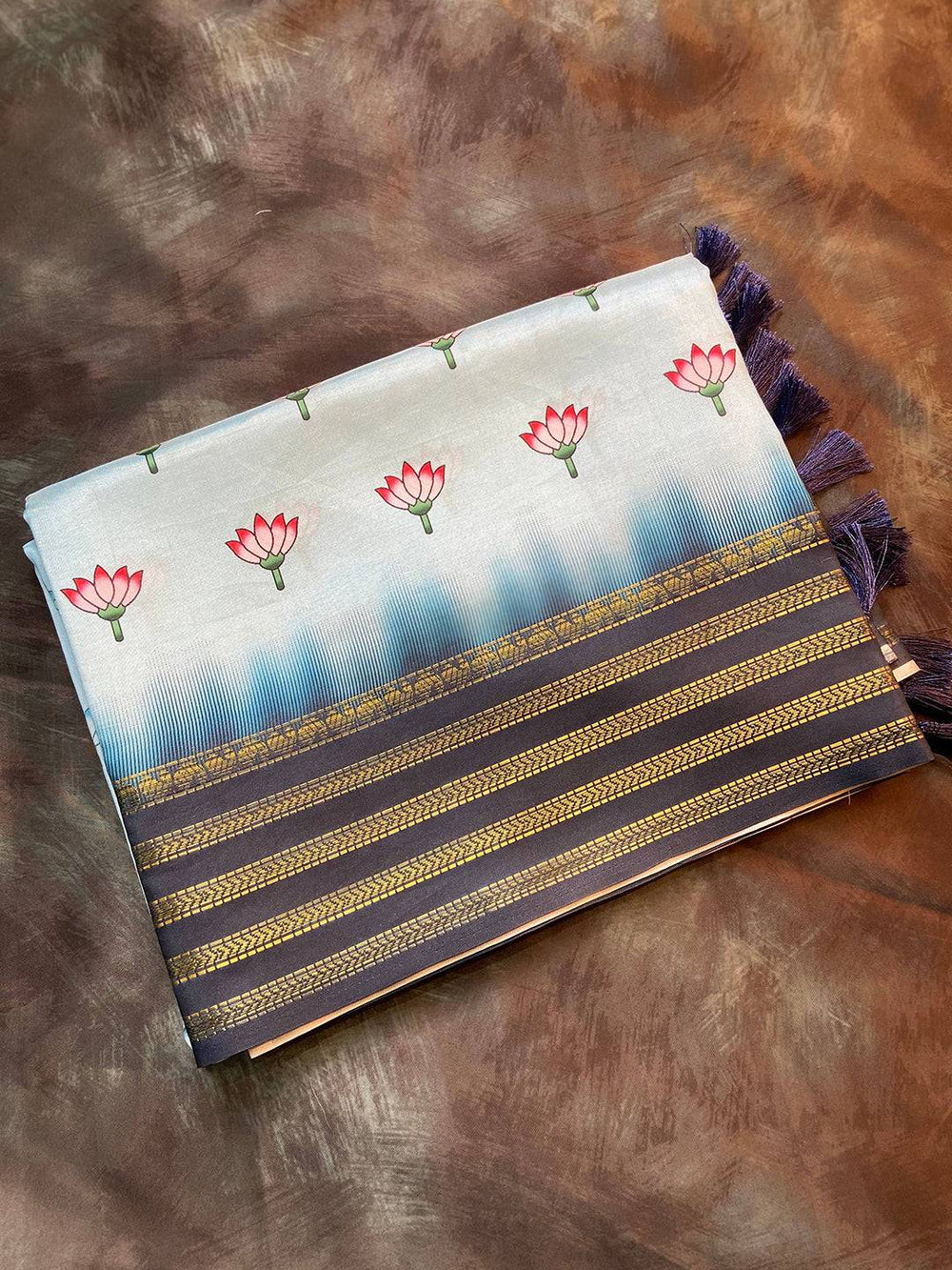 Folded lotus print saree with dark blue and gold border
