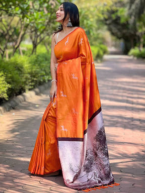Side view of orange soft silk saree with intricate pallu