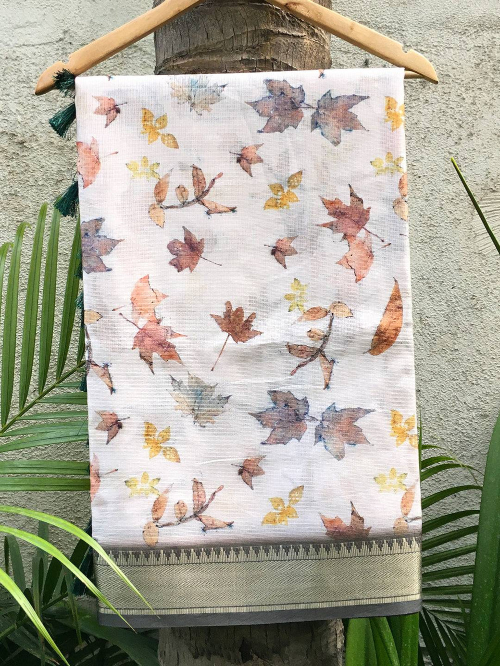 Kanjivaram off white saree with gold zari border and leaf print