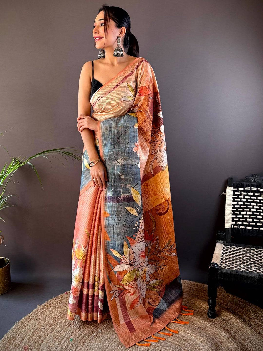 Model showcasing Light Orange Semi Zari Tussar Floral Saree