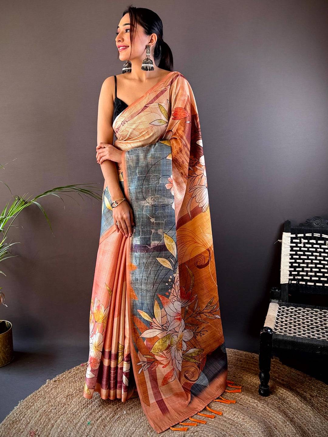 Model showcasing Light Orange Semi Zari Tussar Floral Saree