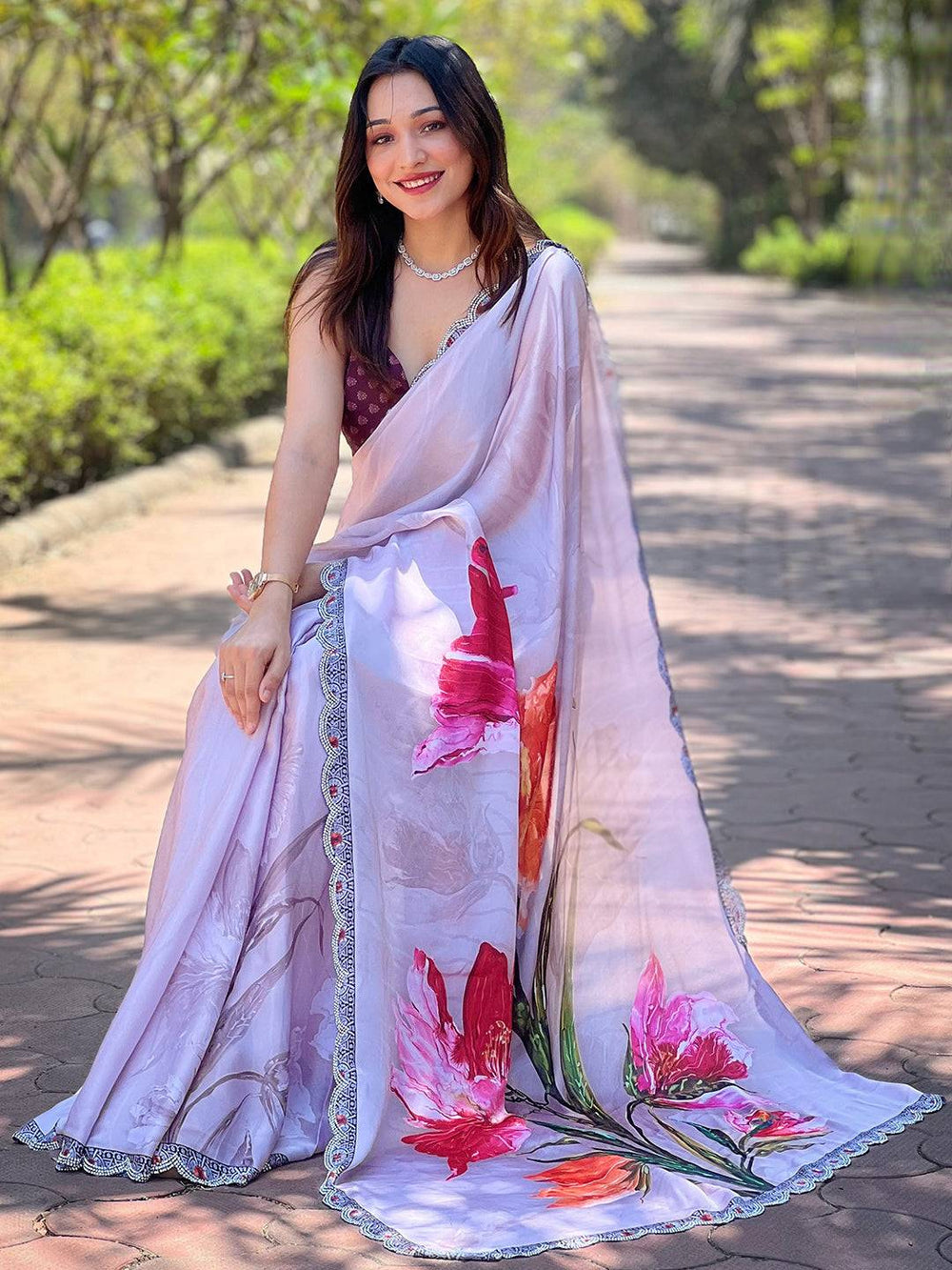 Grey satin georgette saree showcasing vibrant floral print