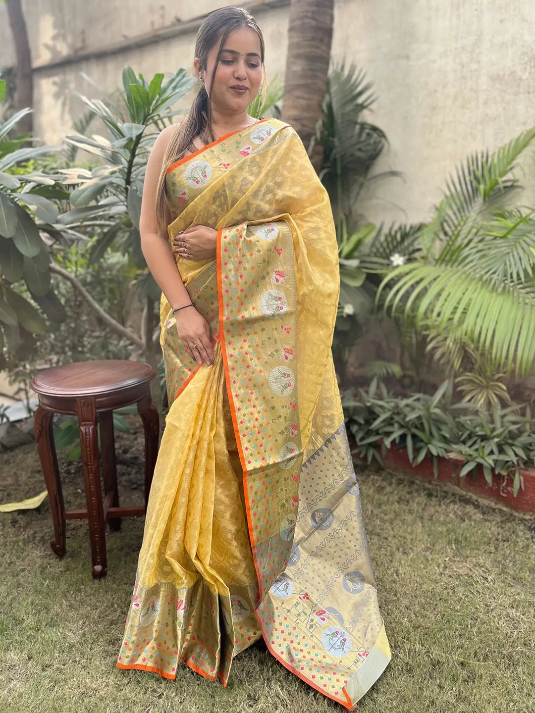 Yellow Kota Doria silk saree with intricate Minakari Patola weaving