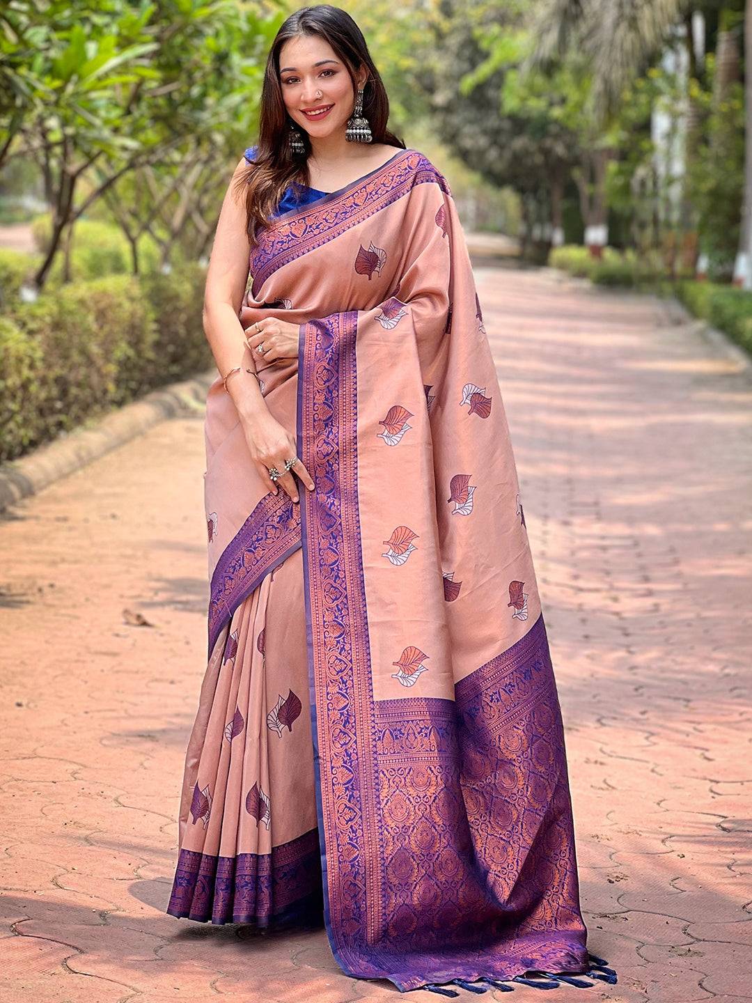 Full view of pastel peach saree with intricate purple border