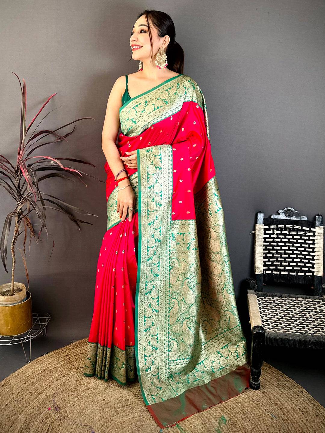 Bright Pink Soft Silk Kanjivaram Saree draped on model with green blouse and traditional jewelry