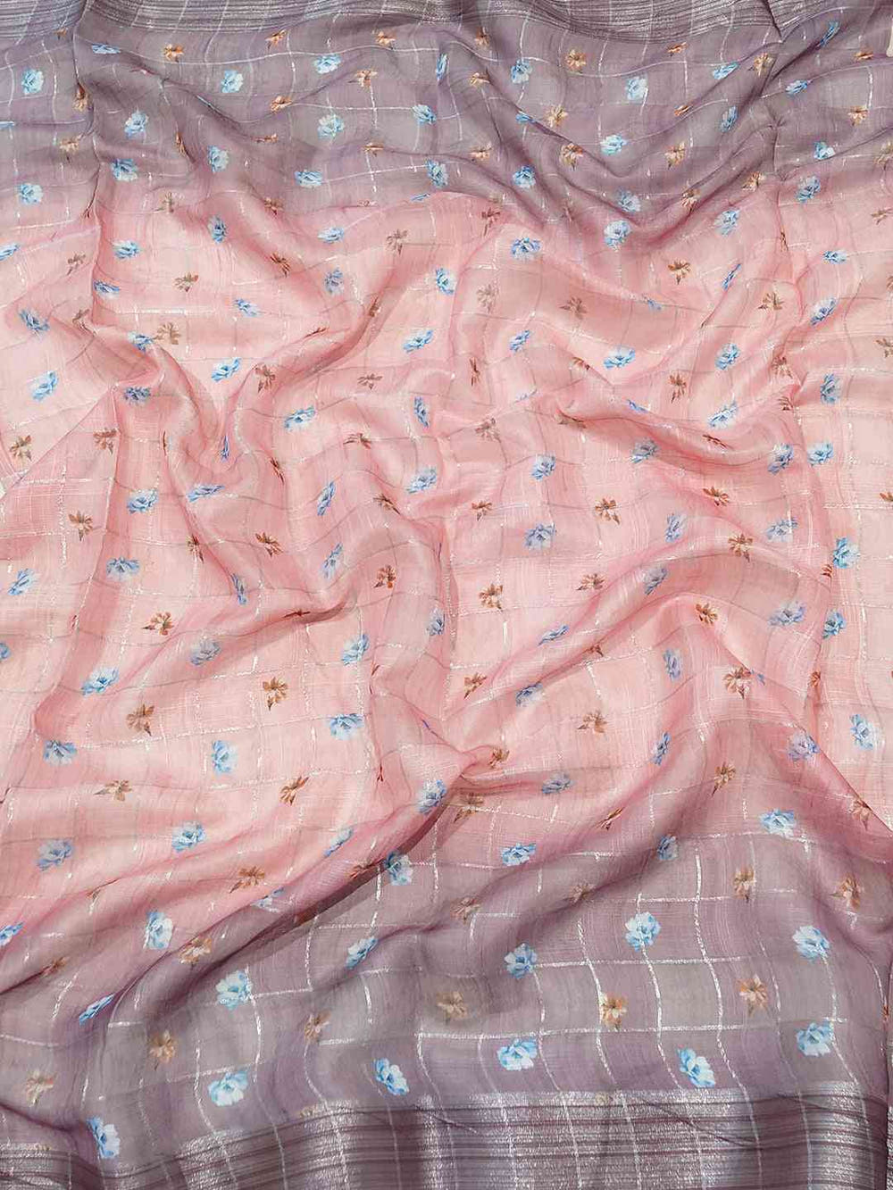 Close-up of floral print linen saree with zari chex
