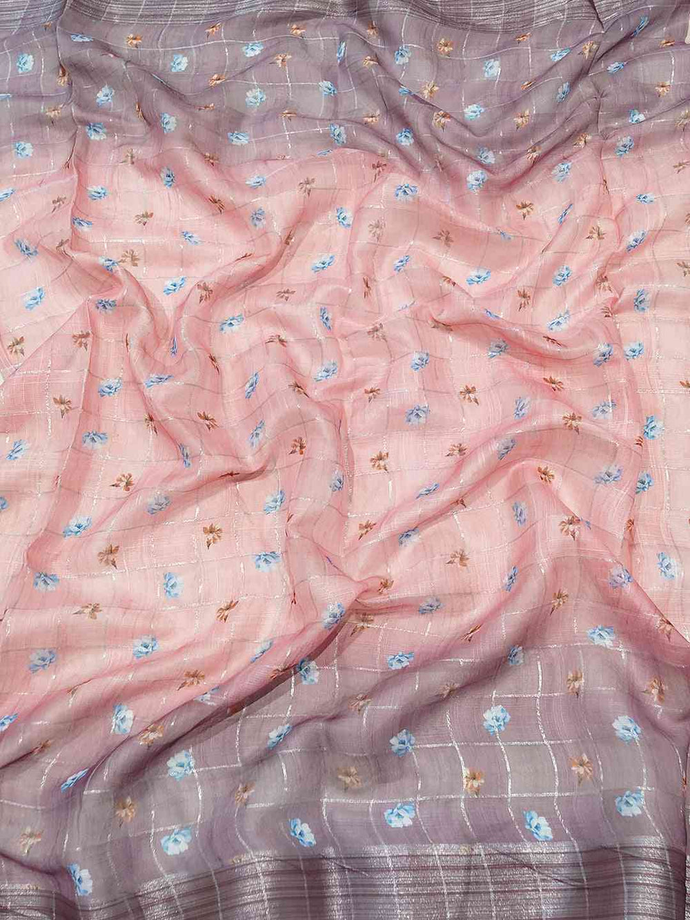 Close-up of floral print linen saree with zari chex