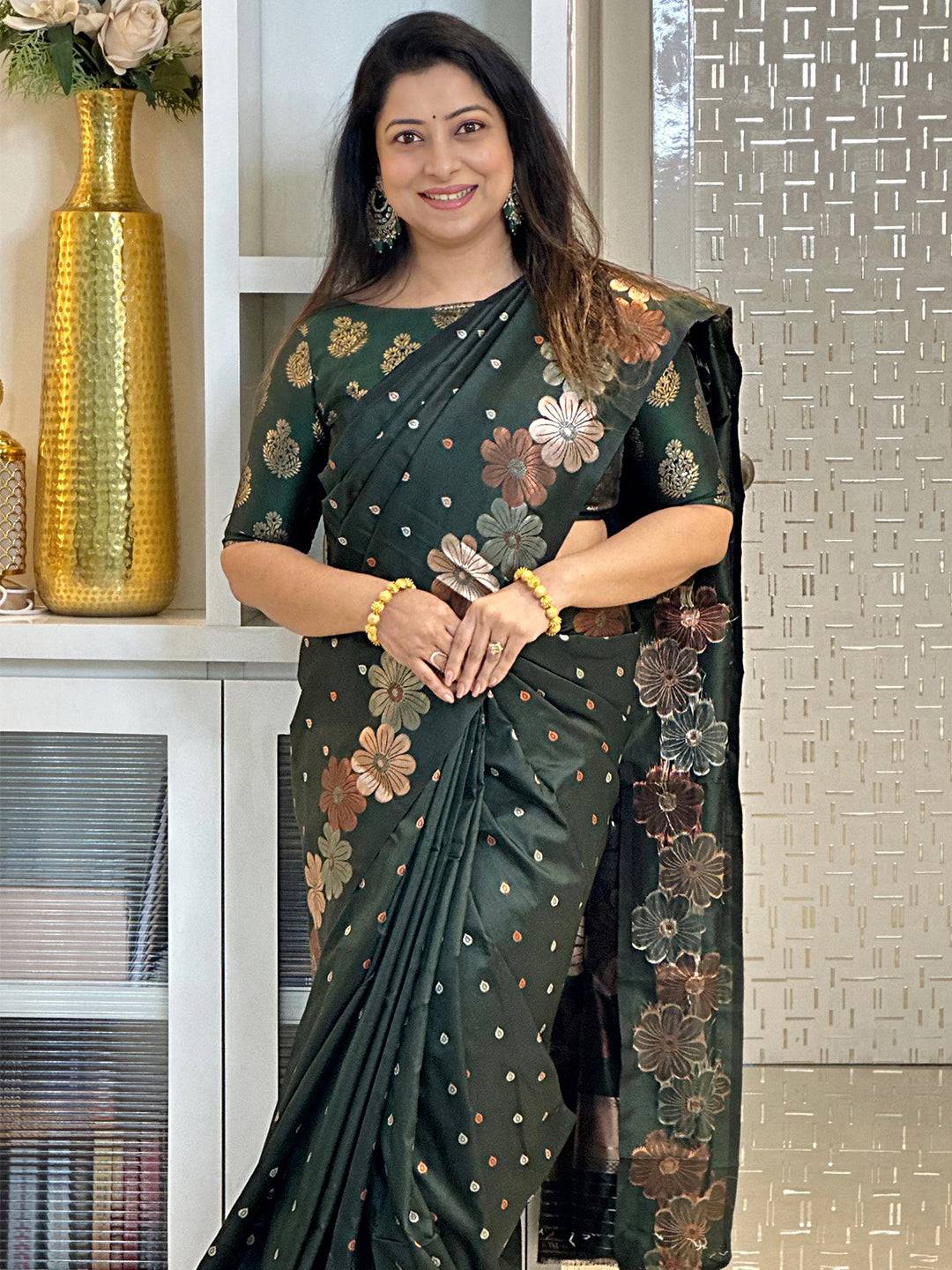 Dark green soft silk saree with floral zari design
