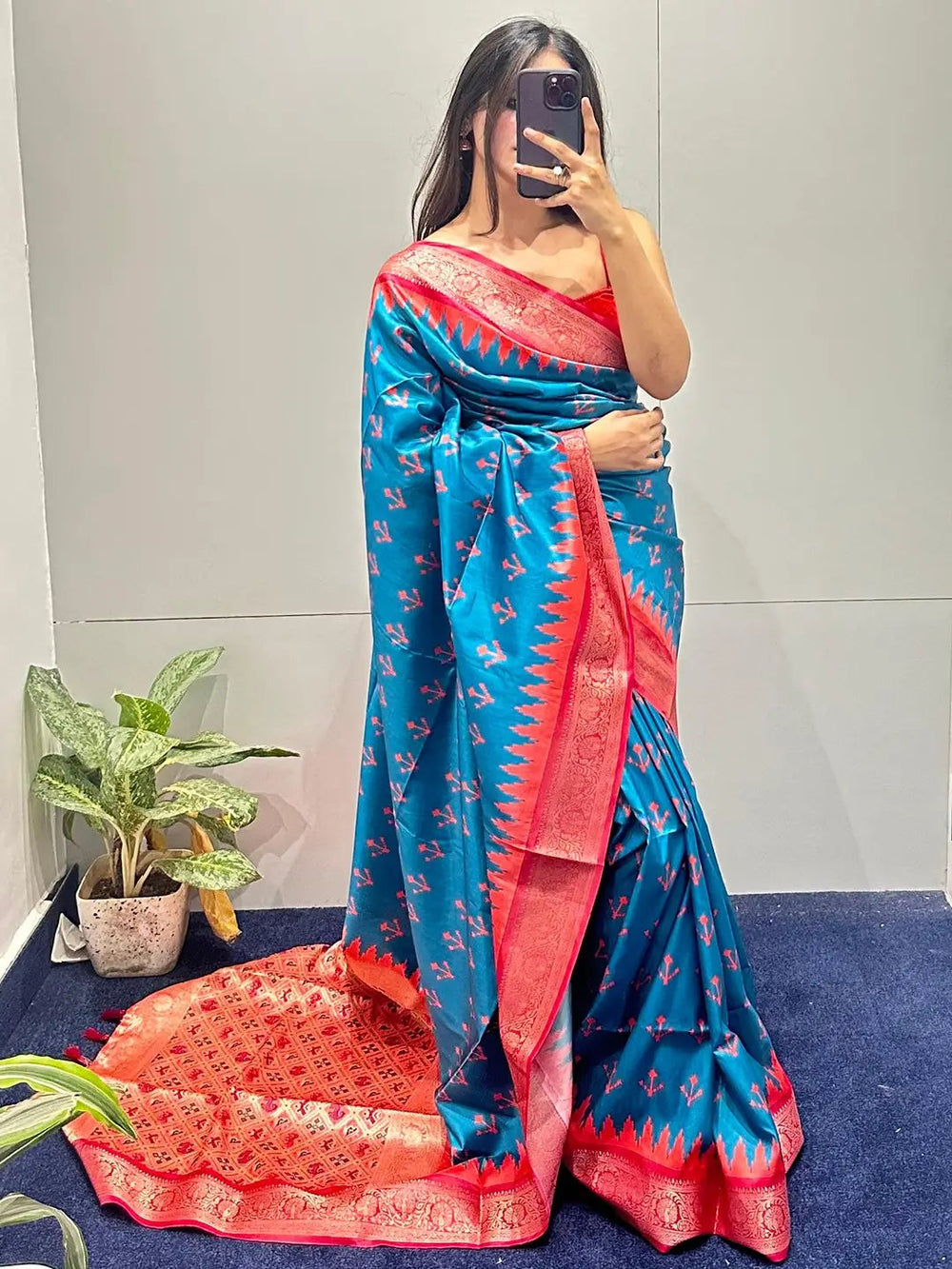 Blue Banarasi silk saree with vibrant red Patola pallu