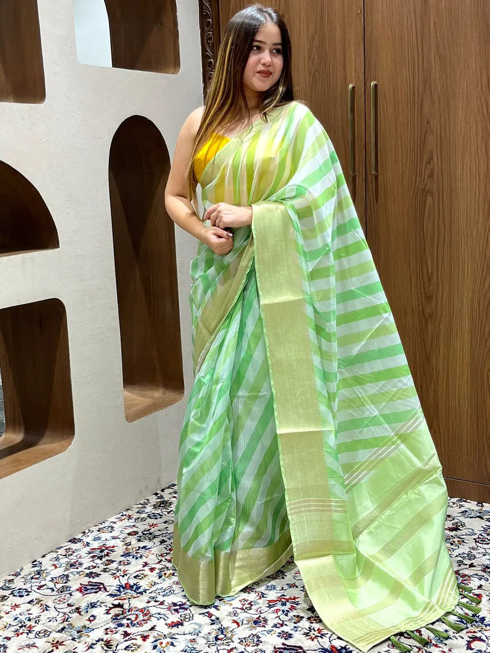 Party wear organza saree featuring leheriya design