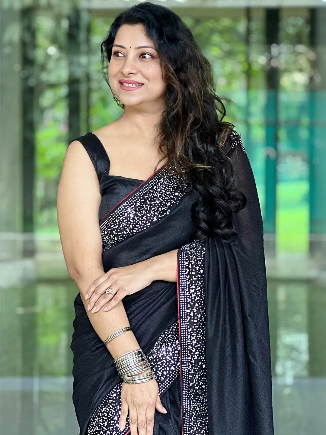 Elegant black poly silk saree with embellished border