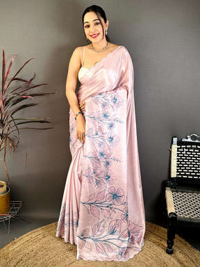 Model wearing pastel pink floral saree with embroidery and flowy fabric