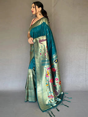 Side view of teal Paithani saree with intricate zari border.