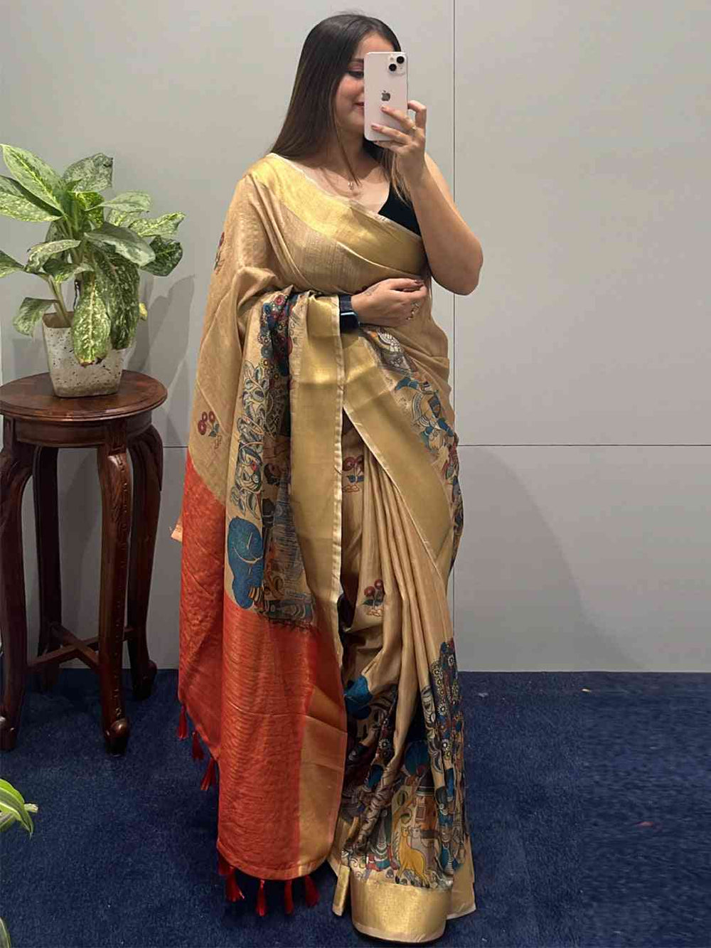 Woman posing in Kalamkari linen tissue saree