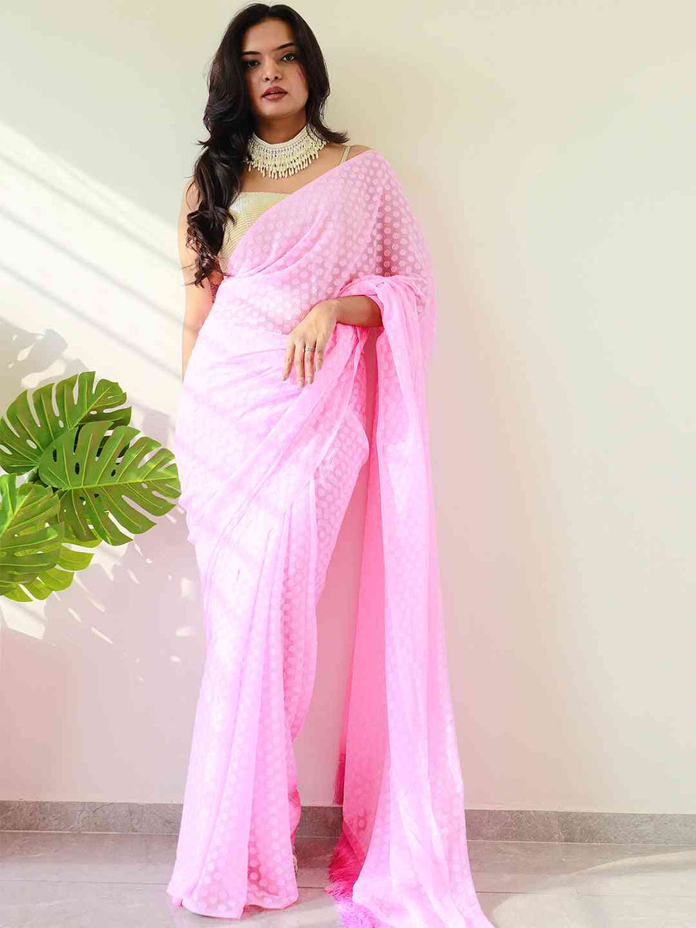 Soft pink georgette saree with thread weaving print, elegant party wear.
