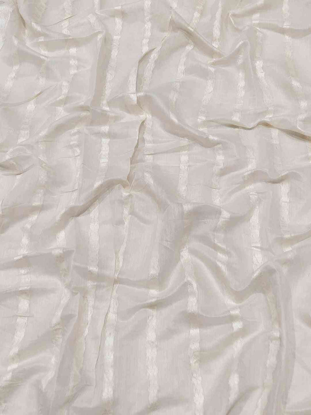 Close-up of white fabric with subtle stripe texture