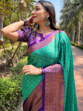 Elegant green and purple Kanjivaram silk saree with intricate blouse