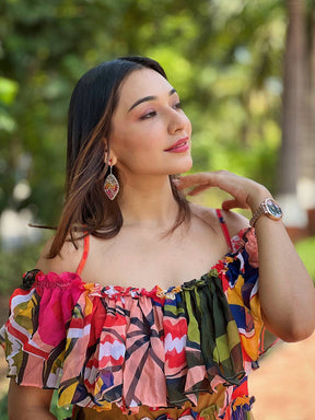 Close-up of woman in vibrant off-shoulder dress